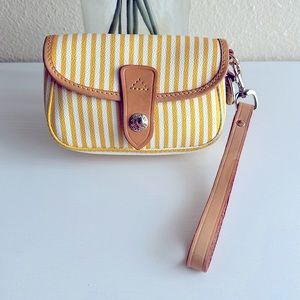 Dooney & Bourke flap front snap wristlet with blue charm